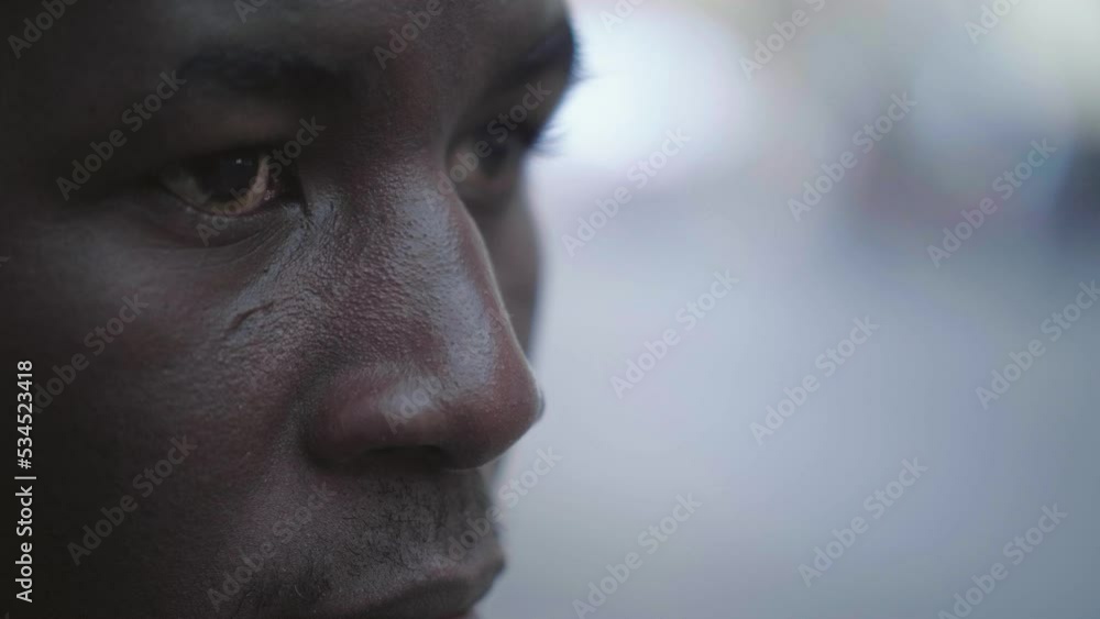 Focus on despair, depression.Young African man despairing in the street Focus on despair, depression.Young African man despairing in the street