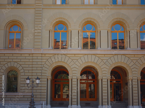 travel to Bern, Switzerland in summer, federal palace with swiss flag