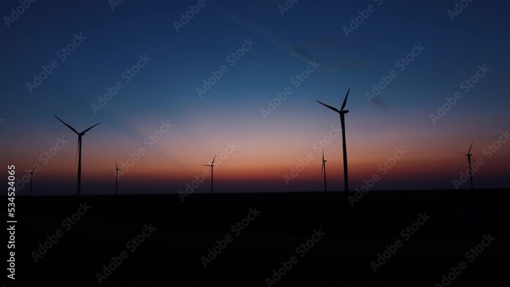Windmill farm park and turbines for producing green electricity. Drone point of view.
Windmill farm park and turbines for producing green electricity. Drone point of view.