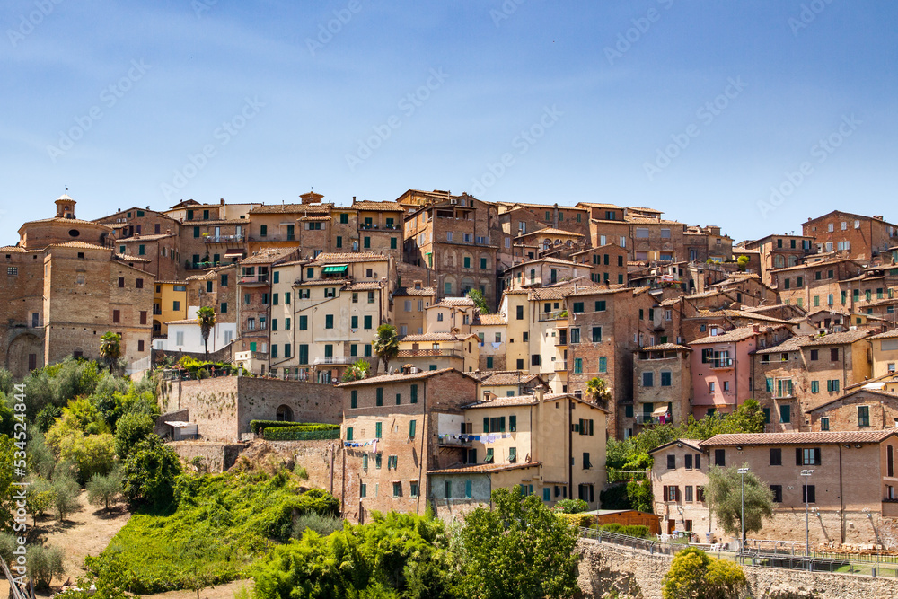 Typical brown houses of Siena in Italy on a sunny day