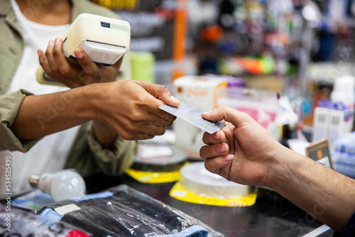 Customer paying through credit card in hardware shop