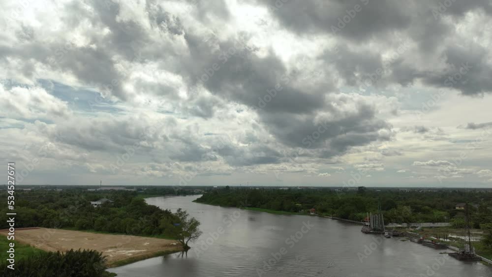 aerial view time lapse of landscape clouds over the river flowing in the rainy season, 4k video aerial view time lapse of landscape clouds over the river flowing in the rainy season, 4k video