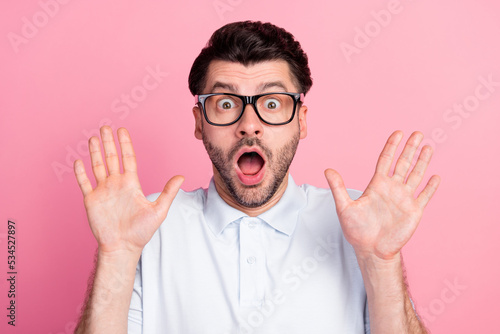 Closeup photo of young funny attractive handsome bearded guy wear eyeglasses palms up ten number shocked isolated on bright pink color background photo