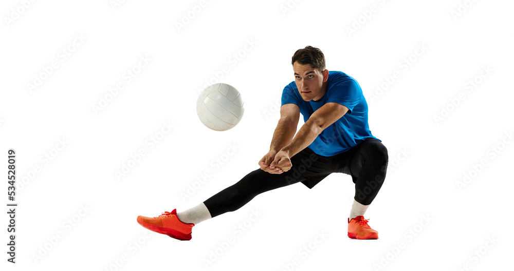 Dynamic portrait of male volleyball player training with ball isolated on white studio background. Sport, gym, team sport, challenges