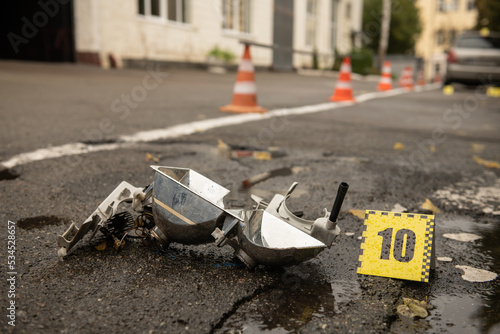 Fotografie Scene of a traffic accident with car wreckage and police numbers indicating stop