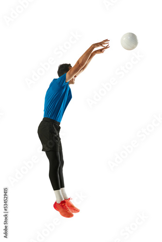 Block. Studio shot of young man, volleyball player playing volleyball isolated on white studio background. Sport, gym, team sport, challenges