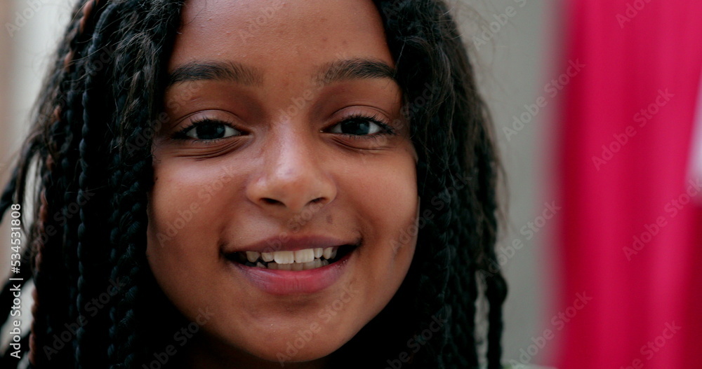Happy hispanic black girl child portrait face close-up smiling Happy hispanic black girl child portrait face close-up smiling