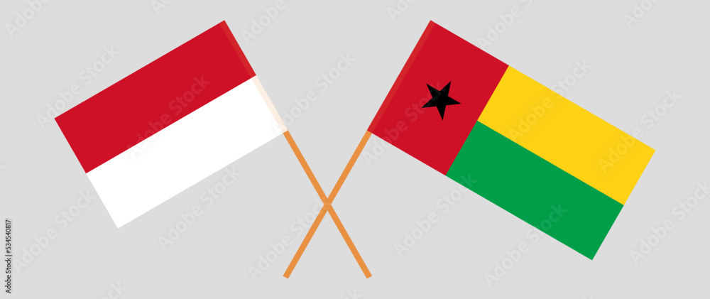 Fototapeta premium Crossed flags of Indonesia and Guinea-Bissau. Official colors. Correct proportion