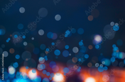 Blurred bokeh light background, Christmas and New Year holidays background © natavilman