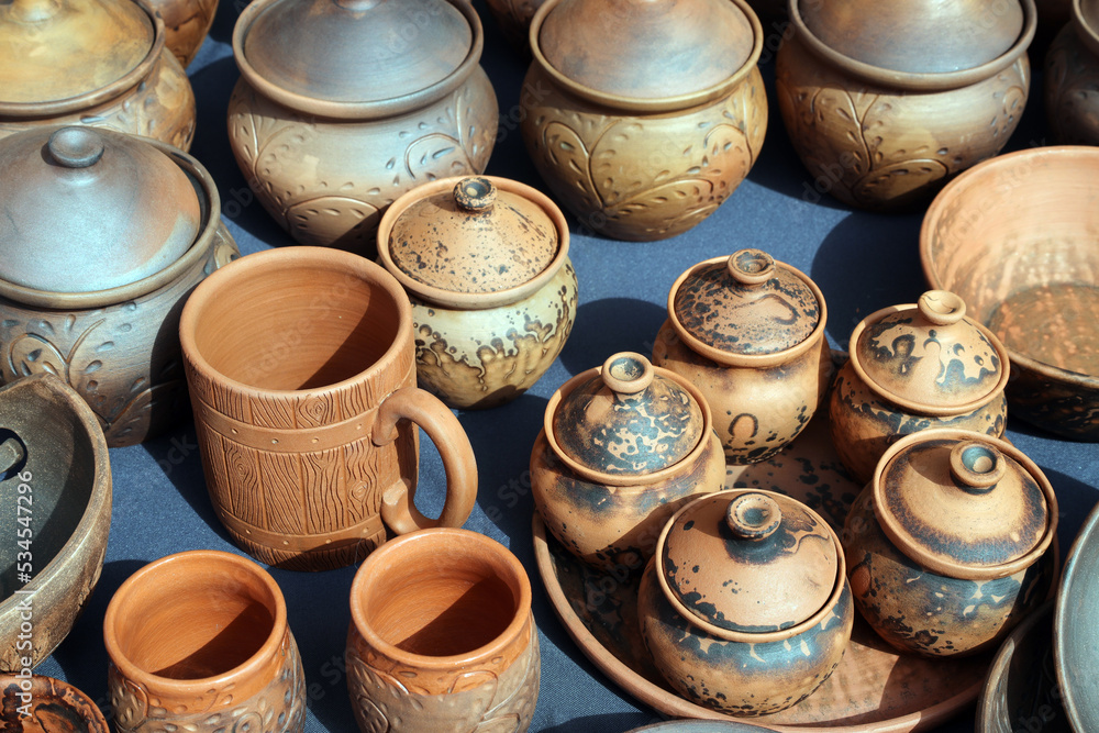 Clay pots and handmade utensils for sale at a craft fair Clay pots and handmade utensils for sale at a craft fair