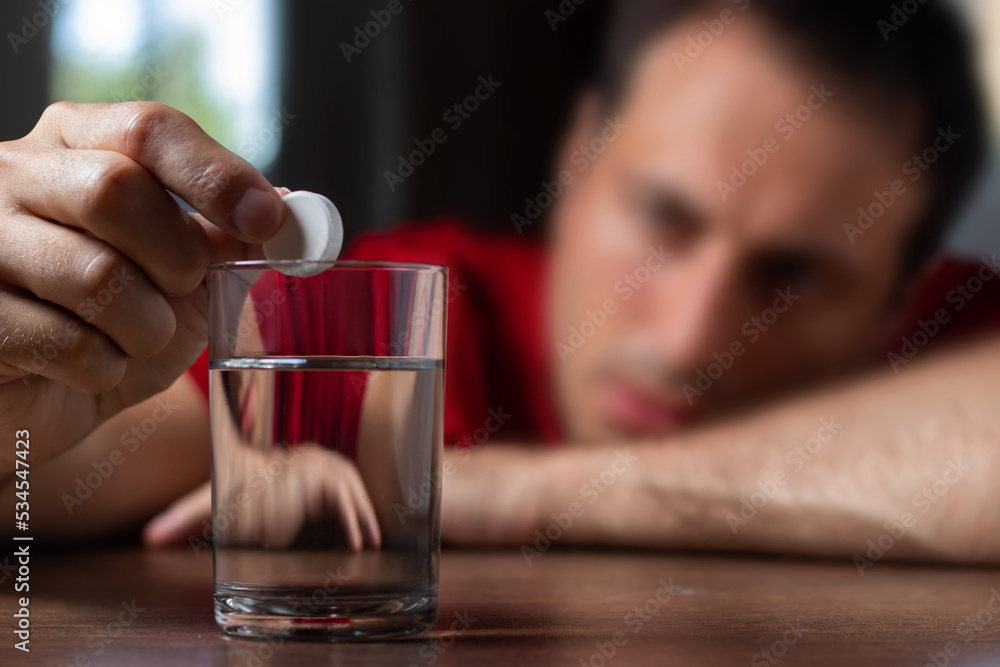 Man With Hangover Taking Medicine Pill Cure