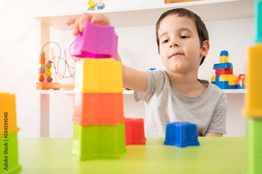 The building blocks of my future. An interested pre-school child building something with plastic blocks. The building blocks of my future. An interested pre-school child building something with plastic blocks.
