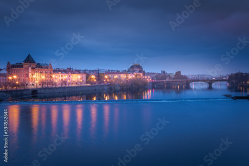 Prague old town and Vltava river illuminated at peaceful dawn  Czech Republic