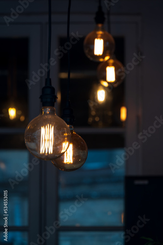 Hanging light bulbs to give raw electric light