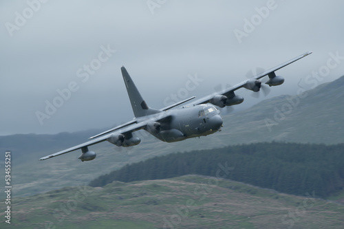 C-130 Hercules transport aircraft low level flying training in mach loop valley Wales