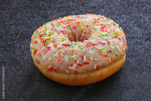 Sweet glazed vanilla donut with icing