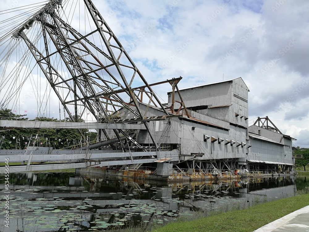 Old dredging ship in a lake remnants of British occupation during war.   