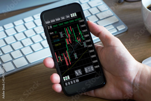 Businessman analyzing forex trading graph financial data. Business finance background.Stock Market Investments Funds