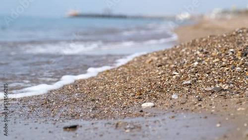 Aerial view over a clear beach and sea photo