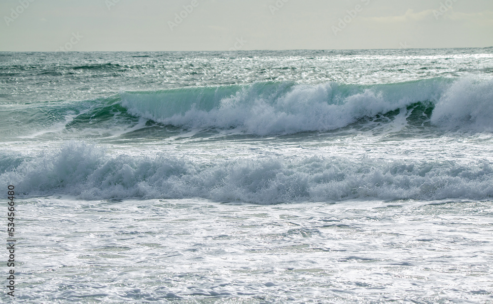 Idyllic silver waves shinih in sun rays water of Atlanti Ocean ( matbe bay) - white wave and silver