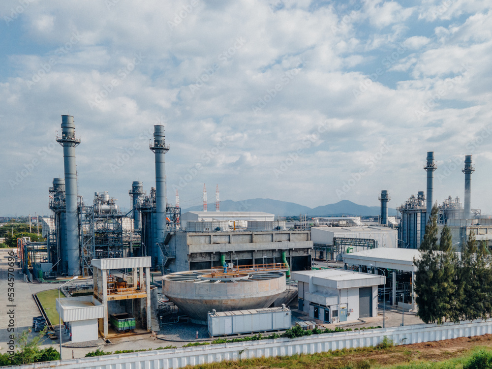 Obraz premium Top view Industrial zone,The equipment of oil refining,Close-up of industrial pipelines of an oil-refinery plant,Detail of oil pipeline with valves in large oil refinery.