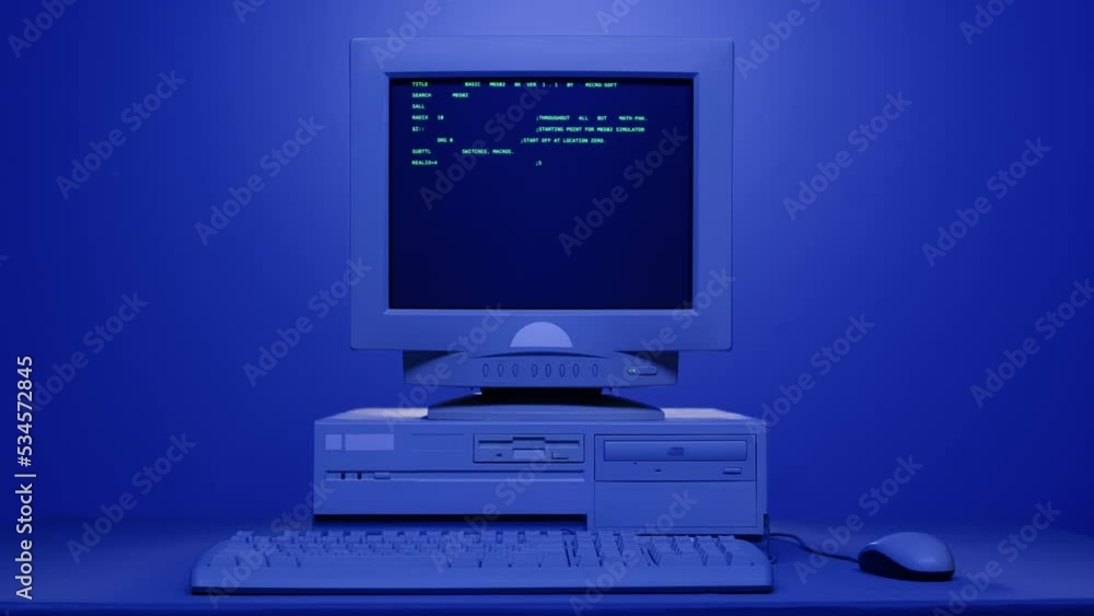 Retro pc with loading code console, programmer making scripts, green basic screen, Old computer studio blue night background close-up, Desktop vintage retro wave display, late 90s PC. Retro pc with loading code console, programmer making scripts, green basic screen, Old computer studio blue night background close-up, Desktop vintage retro wave display, late 90s PC.