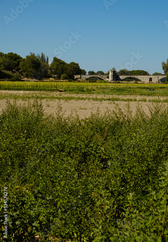 The famous Avignon bridge from an unusual perspective. Farmland. Provence, France.