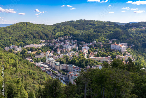 Fototapeta Karlovy Vary, Czech Republic - August 7, 2022: View of the city of Karlovy Vary from the Diana Watchtower, a lookout tower in the spa town of Karlovy Vary