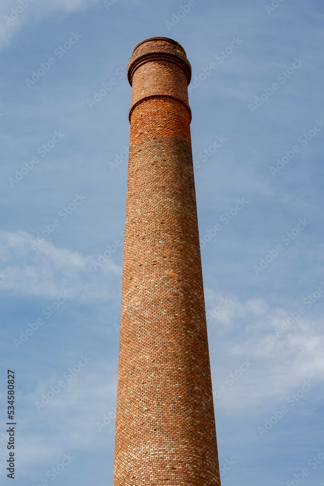 brick chimney over blue sky