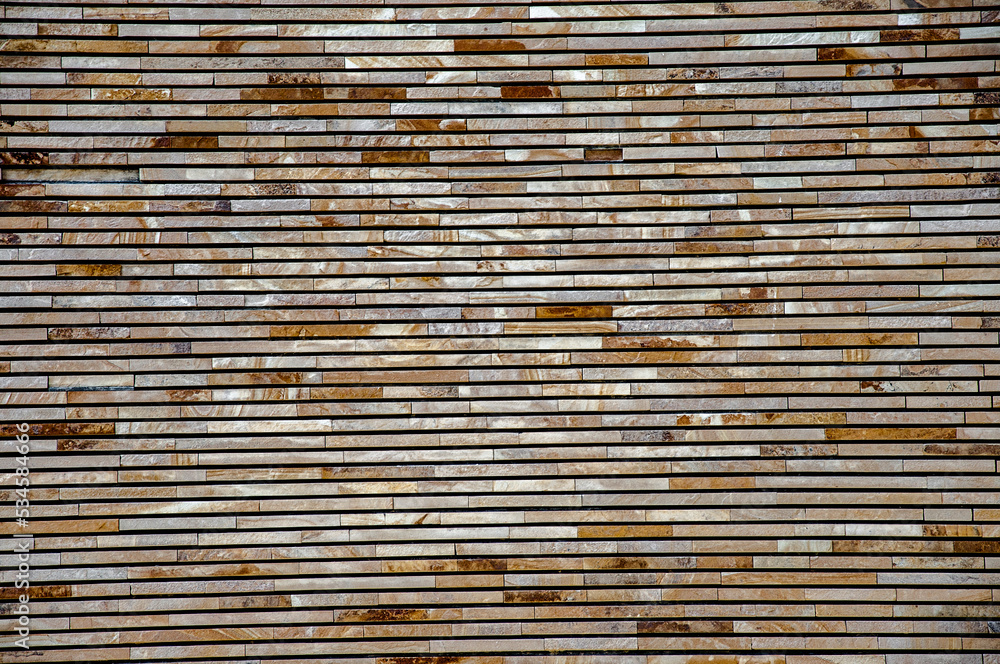 The building wall with tiles of different shades. The building wall with tiles of different shades.