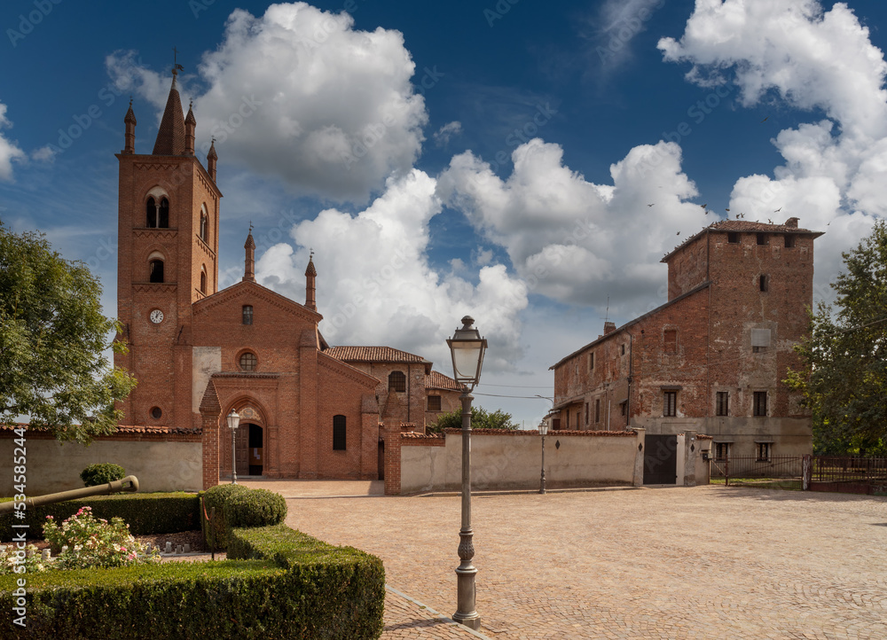 Murello, Cuneo, Piedmont, Italy - September 23, 2022: Templar Castle complex with San Giovanni Battista church in Church Street