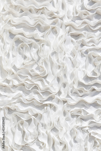 Close up of white ruffled fabric. 