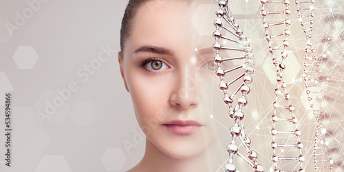 Sensual young woman near glass DNA stems.