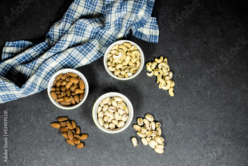 nuts (almonds, pistachio, cashews) in bowls