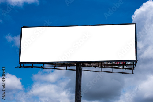 A blank billboard against a blue sky