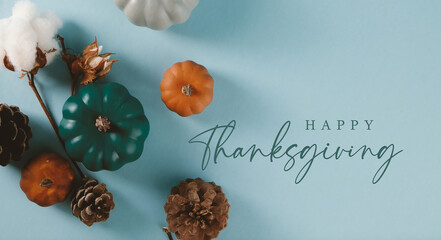 Happy Thanksgiving background with top view of holiday decoration and pumpkins.