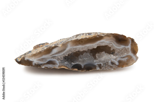 A shard of the chalcedony geode mineral, translucent brown with white veins