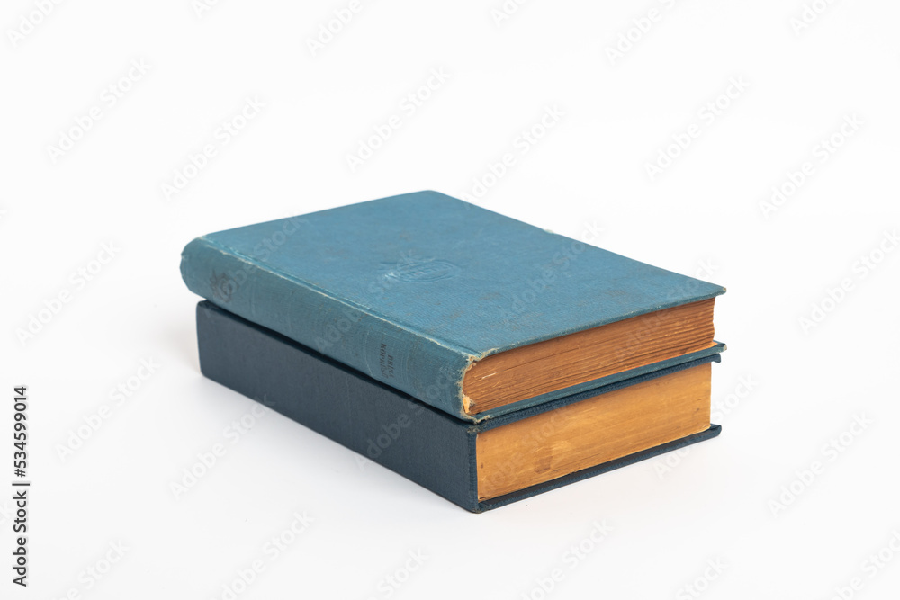 Old blue book isolated on a white background , Old vintage book with a blue cover Old blue book isolated on a white background , Old vintage book with a blue cover