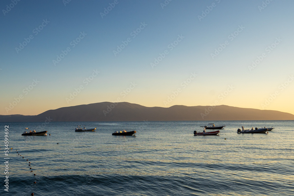 Fishing boats at sunset time in vlore, albania.