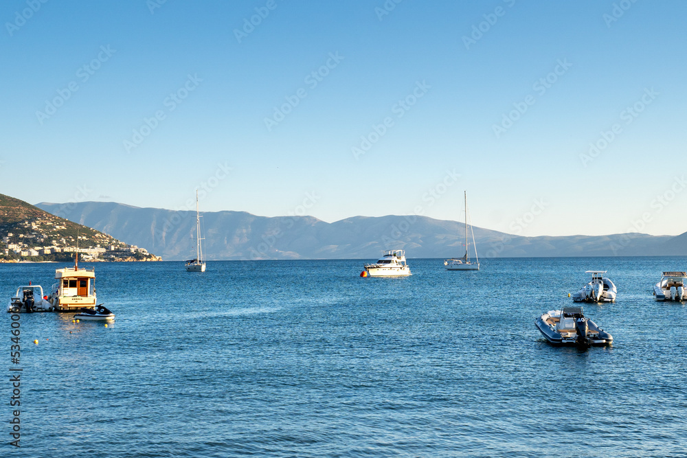 Touristic boats in Adriatic sea coast in the city of Vlore Vlora. Ships docked in the Vlore Harbour Port of Vlora. Albania coastline Touristic boats in Adriatic sea coast in the city of Vlore Vlora. Ships docked in the Vlore Harbour Port of Vlora. Albania coastline
