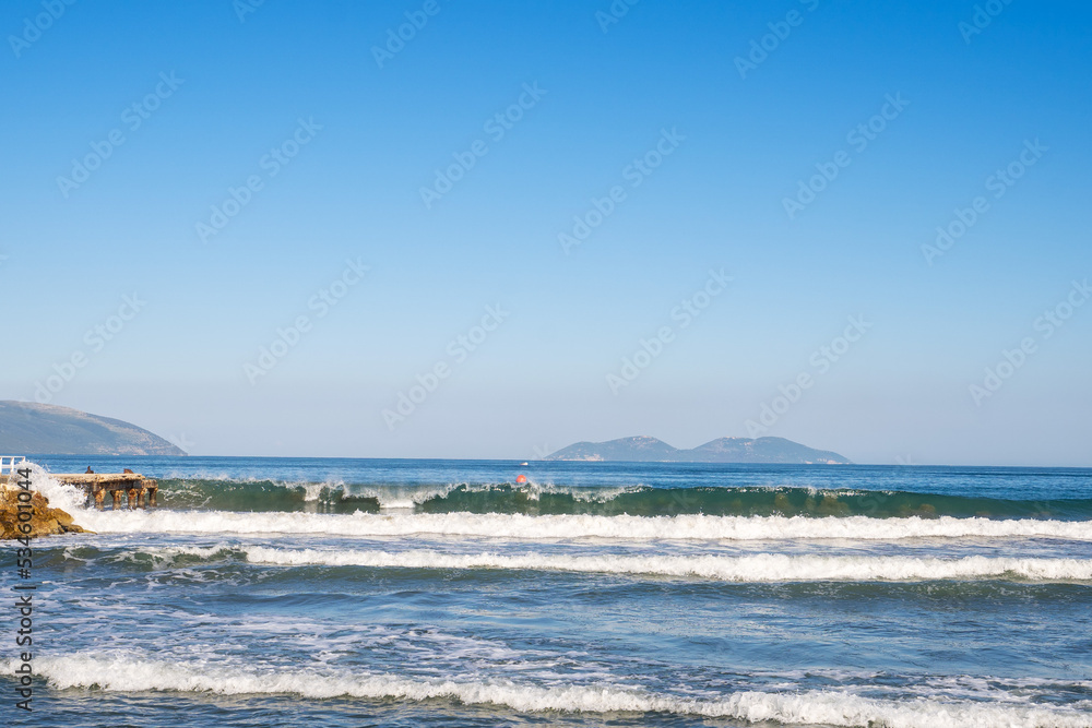 Bright blue ocean in a clear blue sky, with islands on the horizon, Vlore, Albania