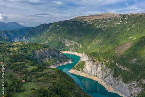 Piva river canyon with reservoir Piva Lake photo
