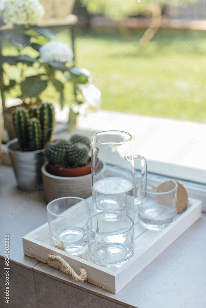 Glasses of water on the windowsill, still life. Glasses of water on the windowsill, still life.