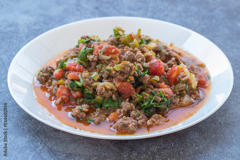 Ground beef, onion, tomato and paprika and a bowl of delicious spicy hot pepper con carne. Ground beef, onion, tomato and paprika and a bowl of delicious spicy hot pepper con carne.