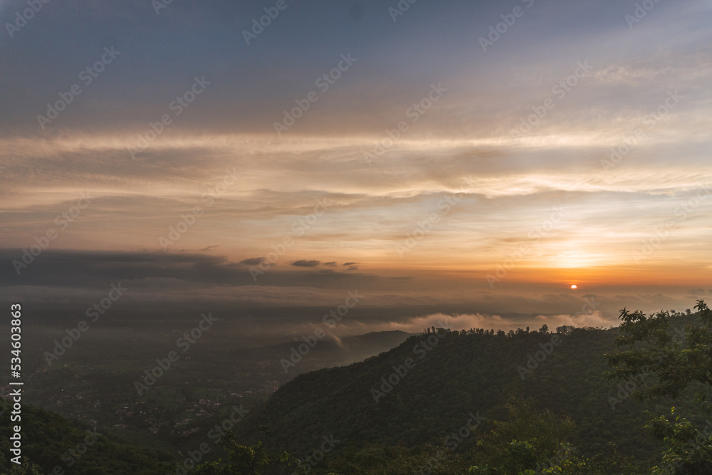 sunset over the mountains - beautiful scenic view - dusk sky