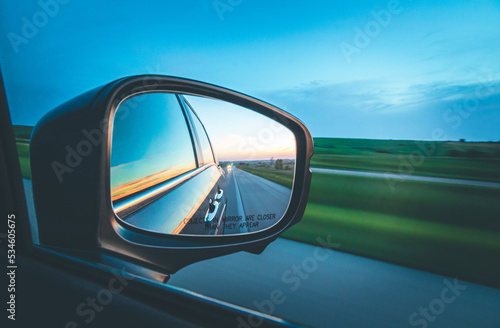 Side mirror of a car looking back