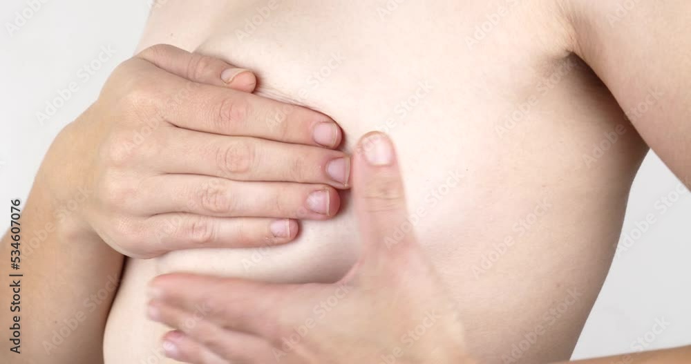 woman palpating her breasts for tumors, prevention and examination of the breast. High quality 4k footage woman palpating her breasts for tumors, prevention and examination of the breast. High quality 4k footage