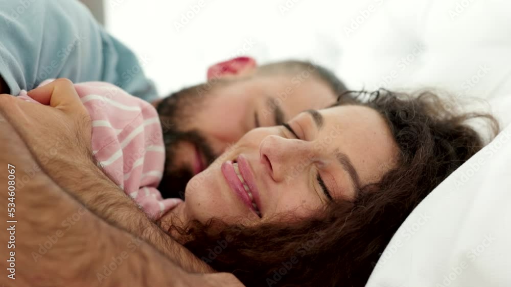 Couple, love and bed with a man and woman kissing in the bedroom of their home together. Love, safe and morning with a husband and wife sleeping or lying in for a peaceful relax in their house Couple, love and bed with a man and woman kissing in the bedroom of their home together. Love, safe and morning with a husband and wife sleeping or lying in for a peaceful relax in their house