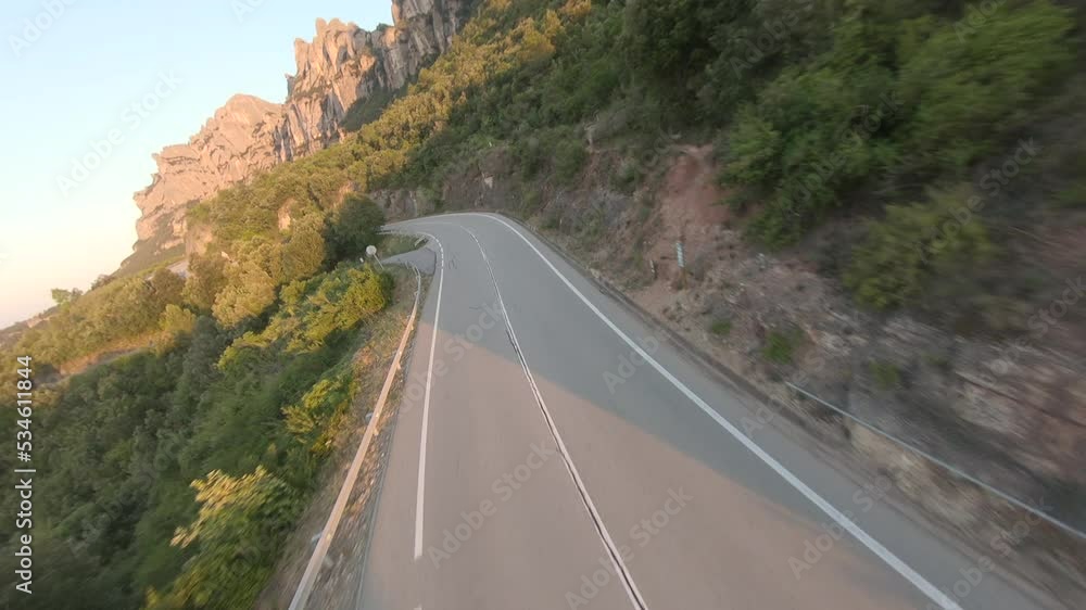 FPV drone flying over trees during sunset. Beautiful landscape with mountains in the background. Montserrat mountains in Spain. Fpv drone. FPV drone flying over trees during sunset. Beautiful landscape with mountains in the background. Montserrat mountains in Spain. Fpv drone.