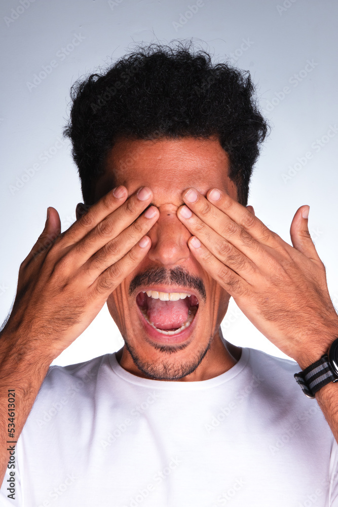 Authentic Portrait - Handsome Black Man Making Expressions with White Shirt Isolated Authentic Portrait - Handsome Black Man Making Expressions with White Shirt Isolated